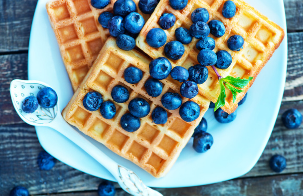 Waffle with blueberry on the plate - Photo, image