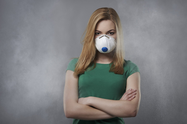Young woman in air pollution concept - Photo, Image