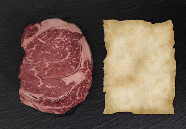 Raw beef steak onblack table - 写真・画像