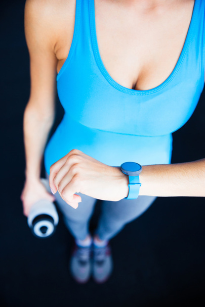 Closeup image of a woman with activity tracker - Foto, Imagen