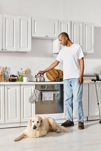 An African American man with myasthenia gravis stands in a warm kitchen setting. - Photo, image