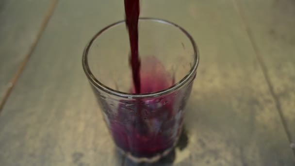 Beet juice. Healthy Beetroot juice in a glass and fresh beetroot on a table. Healthy dieting drink. Fresh beet juice of organic vegetable in domestic. Slow motion video. - Footage, Video
