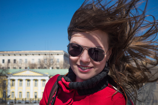Girl in sunglasses with long hair in the wind - Fotografie, Obrázek