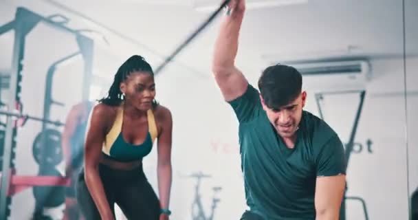 Personal trainer, gym and man with battle ropes, high five and excited for strength training and exercise. Motivation, support and strong male person for fitness, celebrating and proud of goal. - Video