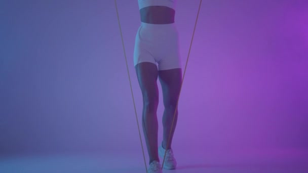 Functional training. Girl doing exercises in neon light. - Footage, Video