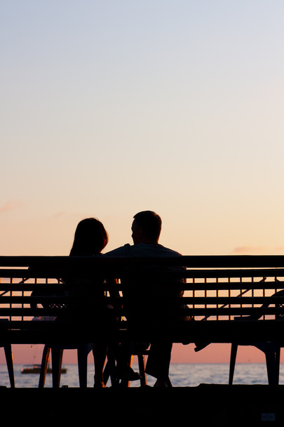 Romantic Couple at Sunset - Zdjęcie, obraz