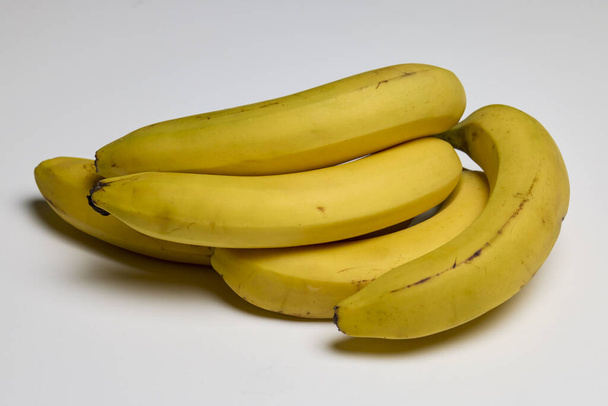 Well-ripened organic bananas on a counter. - Photo, Image