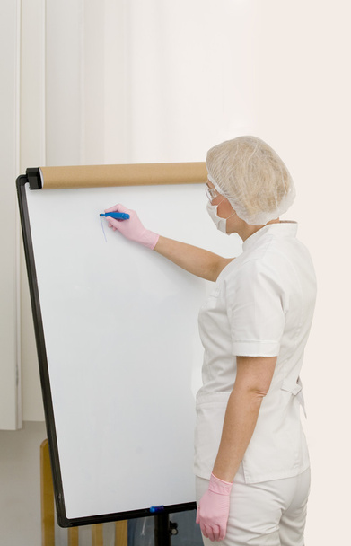 Nurse is writing on the board - Photo, Image