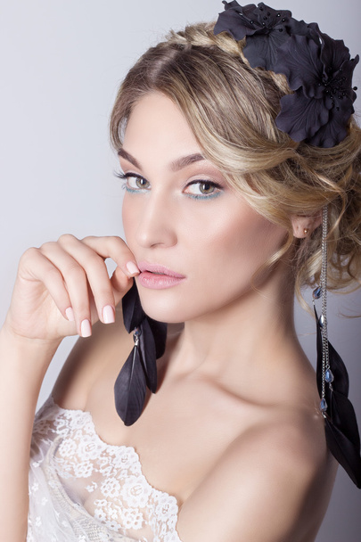 Beautiful young sexy elegant sweet girl in the image of a bride with hair and flowers in her hair , delicate wedding makeup - Photo, Image