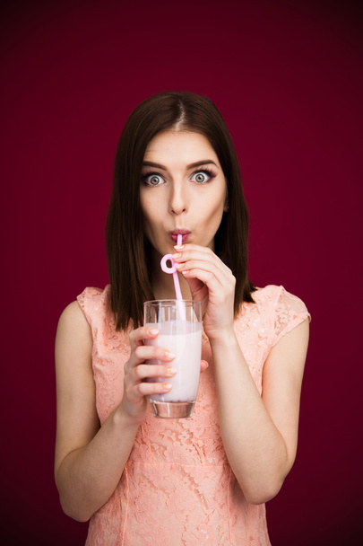 Young pretty woman drinking yogurt - Φωτογραφία, εικόνα