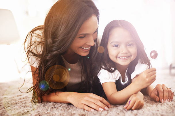 Happy, relax and portrait of mother and child on floor for bonding, relationship and flare in morning. Family, home and mom with young girl in living room for fun, childhood and weekend together. - Photo, Image