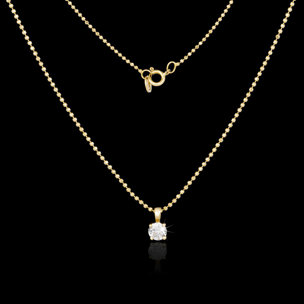 Golden necklace isolated on black background - Photo, Image