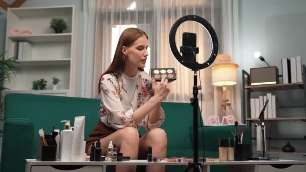 Woman influencer shoot live streaming vlog video review makeup prim social media or blog. Happy young girl with cosmetics studio lighting for marketing recording session broadcasting online. - Filmmaterial, Video
