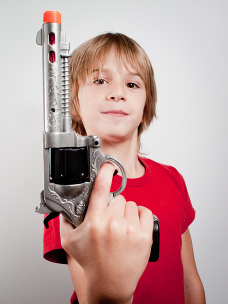 Boy with gun toy - Zdjęcie, obraz