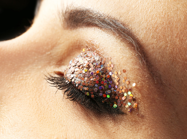 Female eye with fancy glitter makeup, macro view - Φωτογραφία, εικόνα
