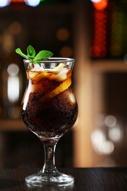 Glass of cocktail in bar on bright blurred background - Zdjęcie, obraz