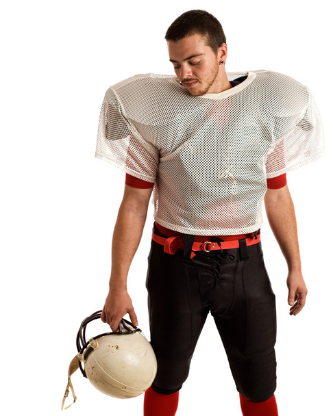 American football player. Studio shot over white. - Foto, Bild