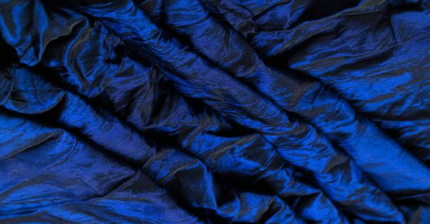 Blue silk fabric. Luxurious, opaque and simply woven, this material features a variety of striping making it the perfect choice for your projects, designs - Photo, Image