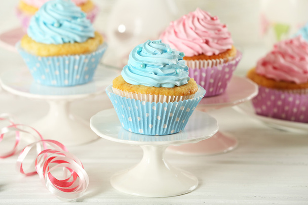 Delicious cupcakes on table on light background - Φωτογραφία, εικόνα