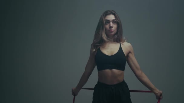 Functional training. Girl doing exercises in cinematic light. - Footage, Video