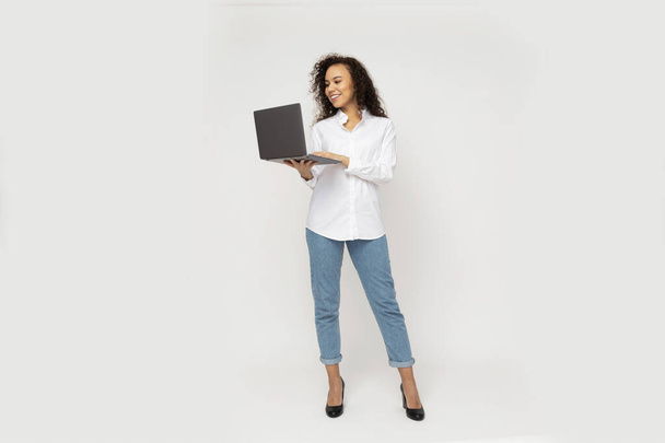 Young attractive girl with laptop in hands - Photo, Image