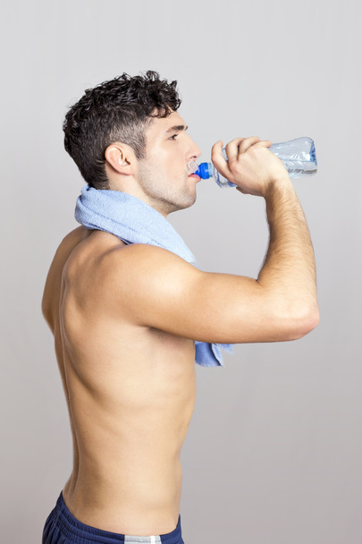 Sport man with bottle - Фото, изображение