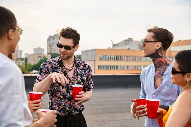good looking joyous interracial friends in casual attires spending time together at rooftop party - Fotoğraf, Görsel
