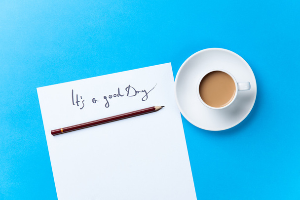 Cup of coffee and paper with inscription - Photo, Image
