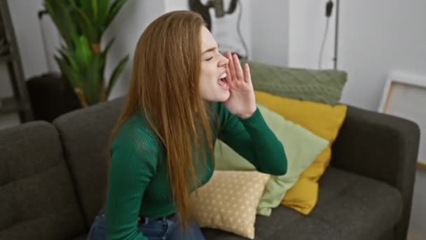 Furious young blonde woman in a sweater loses it indoors; a crazy, loud scream escapes her mouth. anger issues? communication breakdown at home. - Footage, Video