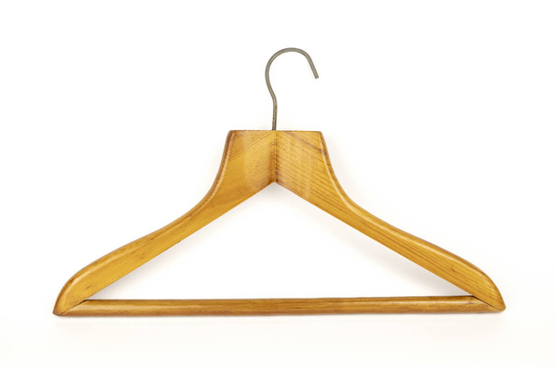 A clothes hanger. Wooden clothes hanger on a white background. - Photo, Image