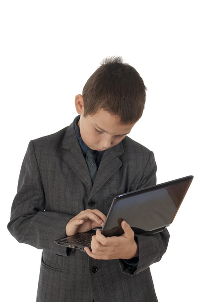 The teenager has control over the laptop - Fotó, kép