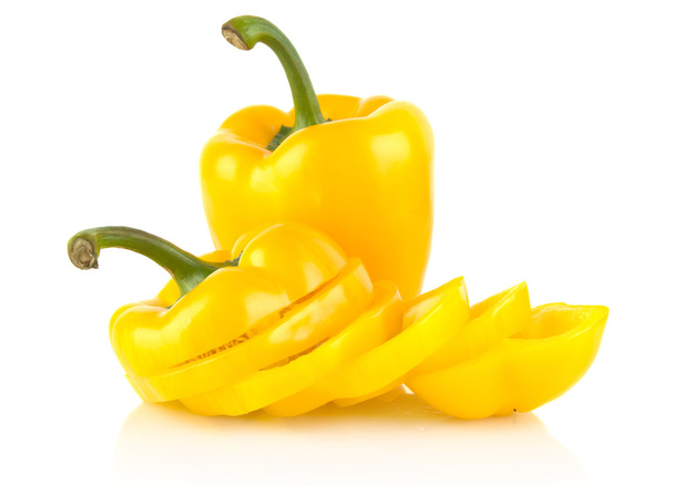Studio shot of slices of yellow bell peppers on white - Foto, Imagem