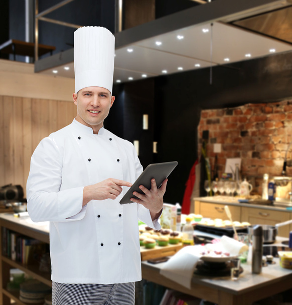 happy male chef cook holding tablet pc - Foto, Imagen
