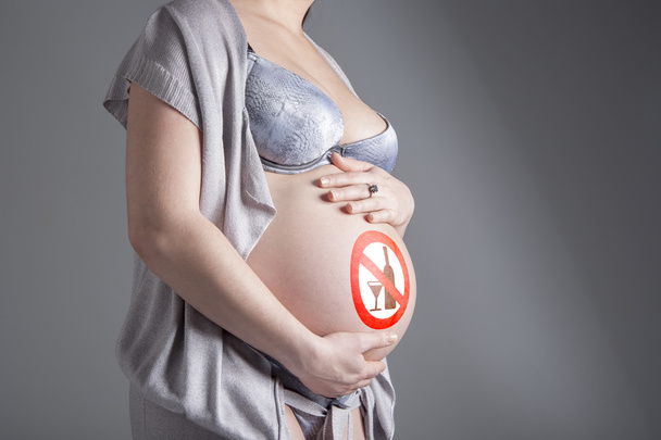 Pregnant woman with sign - Zdjęcie, obraz