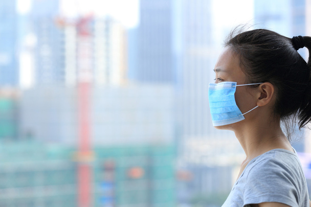 Asian woman in facial mask - Foto, Bild
