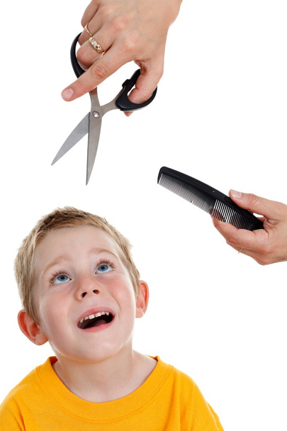 Scared little boy looking up to scissor and comb - Foto, Imagem