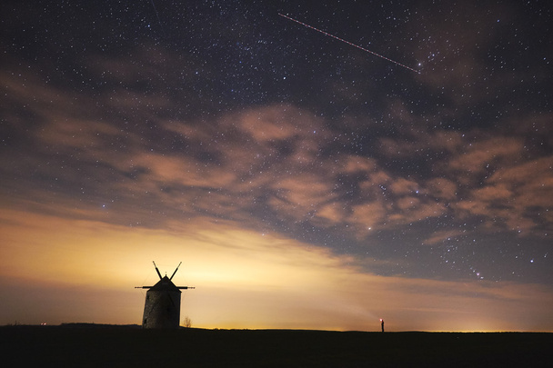 Windmill at night with people - Φωτογραφία, εικόνα