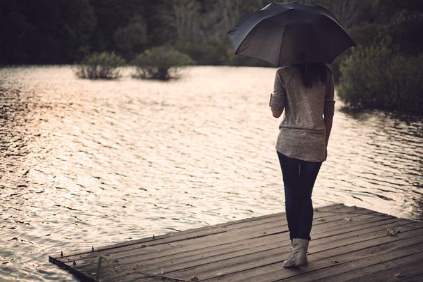 Woman holding umbrella - Foto, Imagem