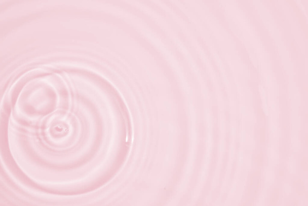 Abstract transparent water shadow surface texture natural ripple on pink background - Photo, Image