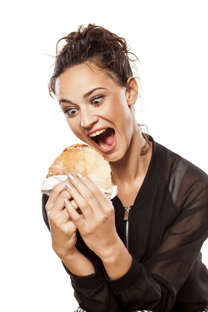 Girl holding sendwich - Φωτογραφία, εικόνα