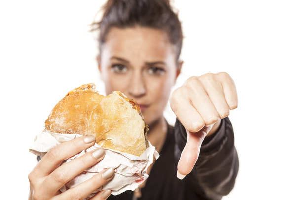 Дівчина тримає бутерброд
 - Фото, зображення