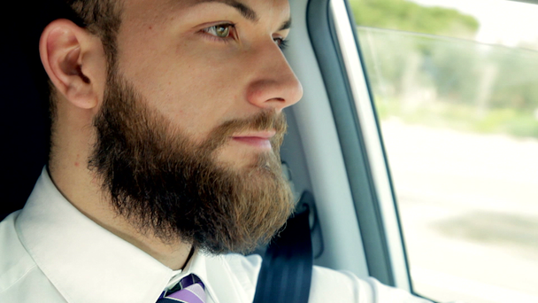 Businessman driving car - Footage, Video