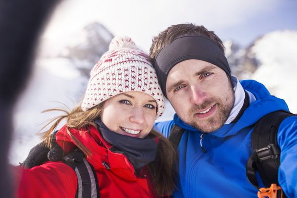 Couple hiking outside in winter nature - Photo, Image