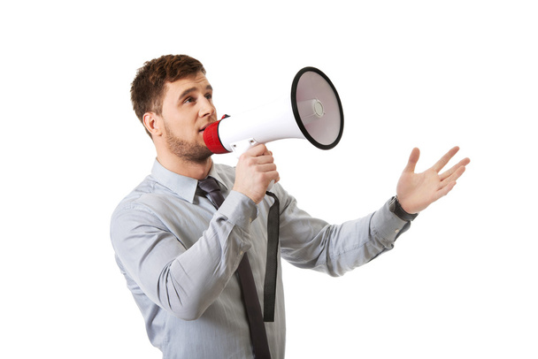 Businessman shouting through megaphone. - Foto, afbeelding