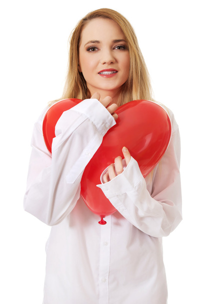 Woman with heart shaped balloon. - Foto, imagen