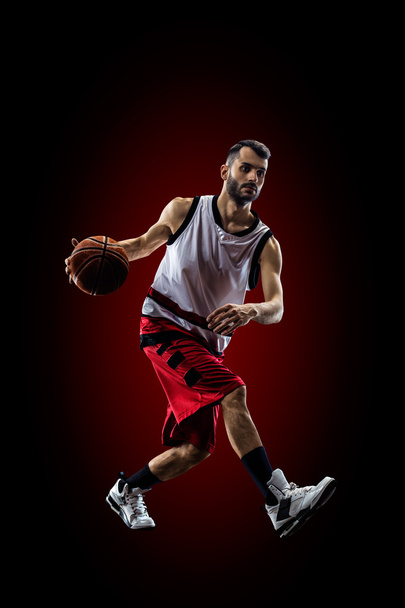 Basketball player in action is flying high - Фото, зображення