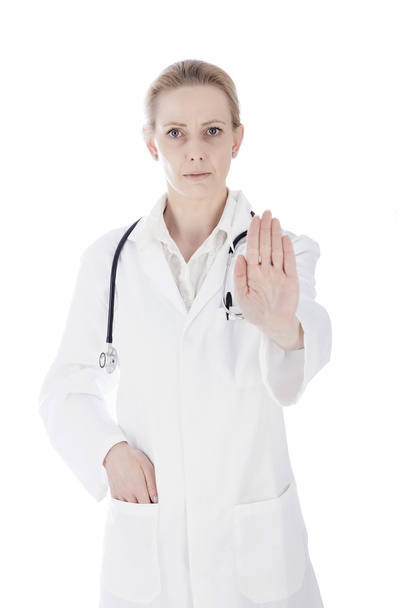 Docteur féminin sérieux montrant stop signe de la main
 - Photo, image