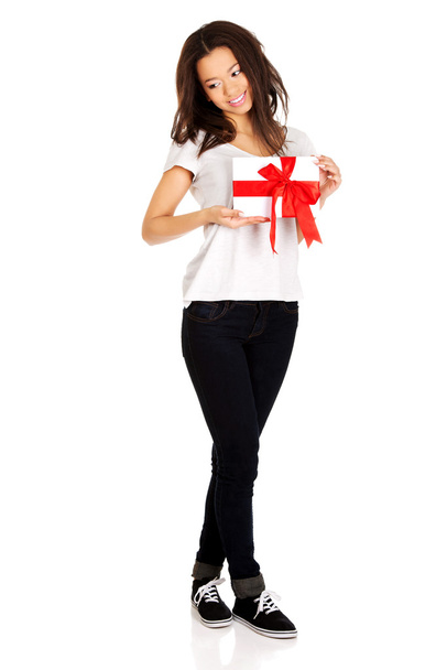 Attractive woman with gift box. - Фото, зображення