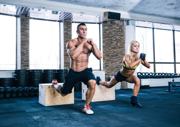 Woman and man working out at gym  - 写真・画像