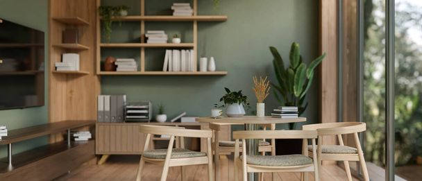 Il design degli interni di un moderno salotto verde ufficio o sala pausa con un tavolo da pranzo, una TV a parete, scaffali e piante da interno. Rendering 3d, illustrazione 3d - Foto, immagini